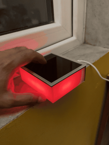 Animated demo of the newest Lumi prototype being picked up and its lid closing, glowing warm the whole time.